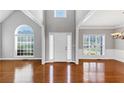 Bright foyer with high ceilings, hardwood floors, large windows, and a view into adjacent rooms at 566 Vintage Pointe Run, Mableton, GA 30126