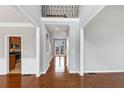 Open foyer with hardwood floors, views to the backyard, and access to the kitchen at 566 Vintage Pointe Run, Mableton, GA 30126
