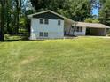 A charming single-story home with a well-manicured front lawn and attached carport at 1520 Oxford St, Douglasville, GA 30134