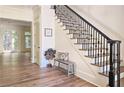 Bright foyer featuring hardwood floors, staircase and view of the light-filled living space at 1632 Brookhaven Close Ne, Atlanta, GA 30319