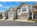 Row of townhomes showing garages, landscaping, and building features in this well-maintained community with street view at 354 Hayden Cir, Woodstock, GA 30189