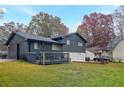 Back of house with deck and large yard at 8451 Magnolia Dr, Jonesboro, GA 30238