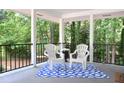Relaxing outdoor patio space with comfortable seating, perfect for enjoying the surrounding greenery at 1140 Starline Se Dr, Smyrna, GA 30080