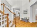 Spacious foyer with hardwood floors, white walls, staircase, and elegant trim, creating a welcoming atmosphere at 5303 Davenport Mnr, Cumming, GA 30041
