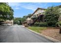 Apartment complex with brick and Tudor style architecture, set in a well-maintained, tree-lined community at 1225 Church St # A, Decatur, GA 30030