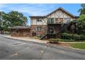 Beautiful apartment complex with Tudor accents, exterior stairs, and manicured landscaping at 1225 Church St # A, Decatur, GA 30030