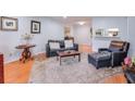 Comfortable living room featuring hardwood floors, fireplace and modern furnishings at 1418 Summit North Ne Dr # 1418, Atlanta, GA 30324