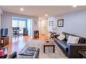 Bright living room with hardwood floors and open layout to workspace at 1418 Summit North Ne Dr # 1418, Atlanta, GA 30324