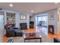 Cozy living room with fireplace, hardwood floors, and adjacent workspace at 1418 Summit North Ne Dr # 1418, Atlanta, GA 30324