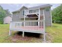 Spacious back deck featuring white wooden railings, perfect for entertaining and outdoor relaxation at 3342 Windpointe Ct, Buford, GA 30519