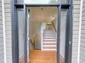 Inviting entryway showcasing hardwood floors, stairs to the upper level, and ample natural light at 3342 Windpointe Ct, Buford, GA 30519