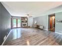 Bright open living room with light gray walls, modern flooring, stone fireplace and lots of natural light at 3814 Lamar Way, Snellville, GA 30039