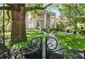 Charming home featuring manicured landscaping and a gated entrance at 908 N Highland Ne Ave, Atlanta, GA 30306