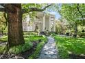 Traditional home with manicured front yard, walkway, and mature landscaping at 908 N Highland Ne Ave, Atlanta, GA 30306