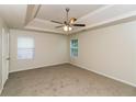 Spacious bedroom featuring a ceiling fan and two windows, offering a bright and airy atmosphere at 137 Legend Creek Dr, Canton, GA 30114