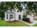 Charming two-story home with a well-manicured lawn and inviting front entrance at 137 Legend Creek Dr, Canton, GA 30114