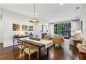 Bright living room with a fireplace, large windows, hardwood floors, and an open concept design at 214 Vickery Falls Dr, Roswell, GA 30075