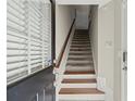 Inviting entryway with hardwood stairs and natural light at 3708 Ashford Creek Ne Hl # 3708, Atlanta, GA 30319