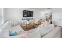 Spacious living area with modern decor, a comfortable sectional, and stylish furnishings at 1388 Ben Park Way, Grayson, GA 30017