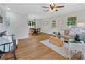 Open-concept living room with hardwood floors, neutral tones, and ample natural light at 4781 Lincoln Ne Dr, Kennesaw, GA 30144