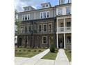 Modern townhome with covered porches and a walkway at 1975 Flying Scotsman Dr # 18, Kennesaw, GA 30144