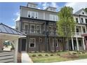 Modern townhome with covered porches and a walkway at 1975 Flying Scotsman Dr # 18, Kennesaw, GA 30144