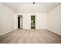 Large main bedroom with vaulted ceilings and neutral carpeting at 4530 Talon Way, Douglasville, GA 30135