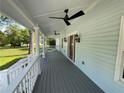 Spacious covered porch featuring ceiling fans and a relaxing outdoor living space at 5191 Nw Emory Nw St, Covington, GA 30014