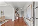 Elegant foyer featuring hardwood floors, a staircase with iron spindles, and classic trim at 1345 Hilltop Overlook Dr, Marietta, GA 30062