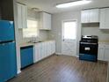 Newly renovated kitchen boasting new appliances, updated cabinets, and modern flooring at 732 Vinson Sw Pl, Atlanta, GA 30315