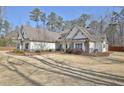 Beautiful single-story home with a well-manicured front yard and stone accents at 209 Wynnward Way, Sharpsburg, GA 30277