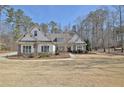 Charming single-story home with a well-manicured front yard at 209 Wynnward Way, Sharpsburg, GA 30277