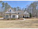 Beautiful single-story home with a well-manicured front yard and stone accents at 209 Wynnward Way, Sharpsburg, GA 30277