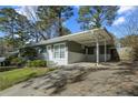 Cozy single-story house with a carport and spacious driveway, set in a tranquil neighborhood at 3680 Larkspur Ter, Decatur, GA 30032