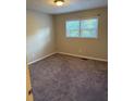 Cozy bedroom featuring neutral walls and plush carpeting for added comfort at 3990 N Quail Dr, Douglasville, GA 30135