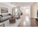 Inviting living area with hardwood floors, white walls, an open door, and lots of natural light creating a cozy atmosphere at 143 Lablanc Nw Way, Atlanta, GA 30327