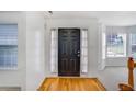 Inviting entryway with hardwood floors, front door with curtains, and natural light at 3550 Willow Tree Trce, Decatur, GA 30034
