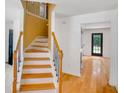 Elegant staircase with wooden banister and iron spindles, leading to the upper level at 3550 Willow Tree Trce, Decatur, GA 30034