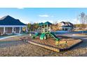 Community playground with slides and climbing structures, set in a landscaped, mulched area at 553 Princeton Elm Place Way, Lawrenceville, GA 30045