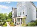 Charming two-story home with blue siding, white trim, covered front porch, and landscaped yard at 3272 Stillwood Dr, Atlanta, GA 30354