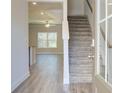 Open entryway with hardwood floors and staircase to the upper level at 4534 Eastbrook Pl, Snellville, GA 30039