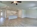 Open concept floor plan with hardwood floors throughout and a kitchen island at 4534 Eastbrook Pl, Snellville, GA 30039