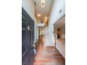 Bright foyer featuring hardwood floors, a staircase to the second floor, and high ceilings at 7979 Larksview Dr, Fairburn, GA 30213