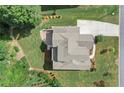 Aerial view of the house with large lot, patio, mature trees and expansive driveway at 125 Registry Ln, Canton, GA 30115