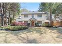 Inviting two-story home featuring a manicured front lawn and a charming, classic facade at 228 Mount Vernon Dr, Decatur, GA 30030