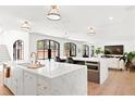 Bright, open kitchen with marble countertops, modern appliances, and ample seating at 228 Mount Vernon Dr, Decatur, GA 30030