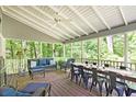 Enjoy the outdoors in the expansive screened porch with vaulted ceiling, dining area and comfortable seating at 4314 Woodhaven Se Way, Smyrna, GA 30082