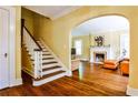 View of the hardwood floors, staircase, fireplace, and doorway into the living room at 50 Rumson Ne Way, Atlanta, GA 30305