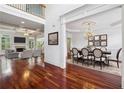 Elegant foyer view of the formal dining room and the living room with cozy fireplace at 2922 Heart Pine Way, Buford, GA 30519