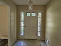 Inviting foyer with a stylish front door and decorative lighting, providing a warm welcome at 417 Ohern Ct, Stone Mountain, GA 30088